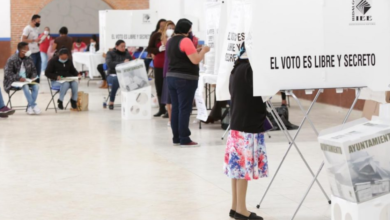 Personas ejerciendo su derecho al voto